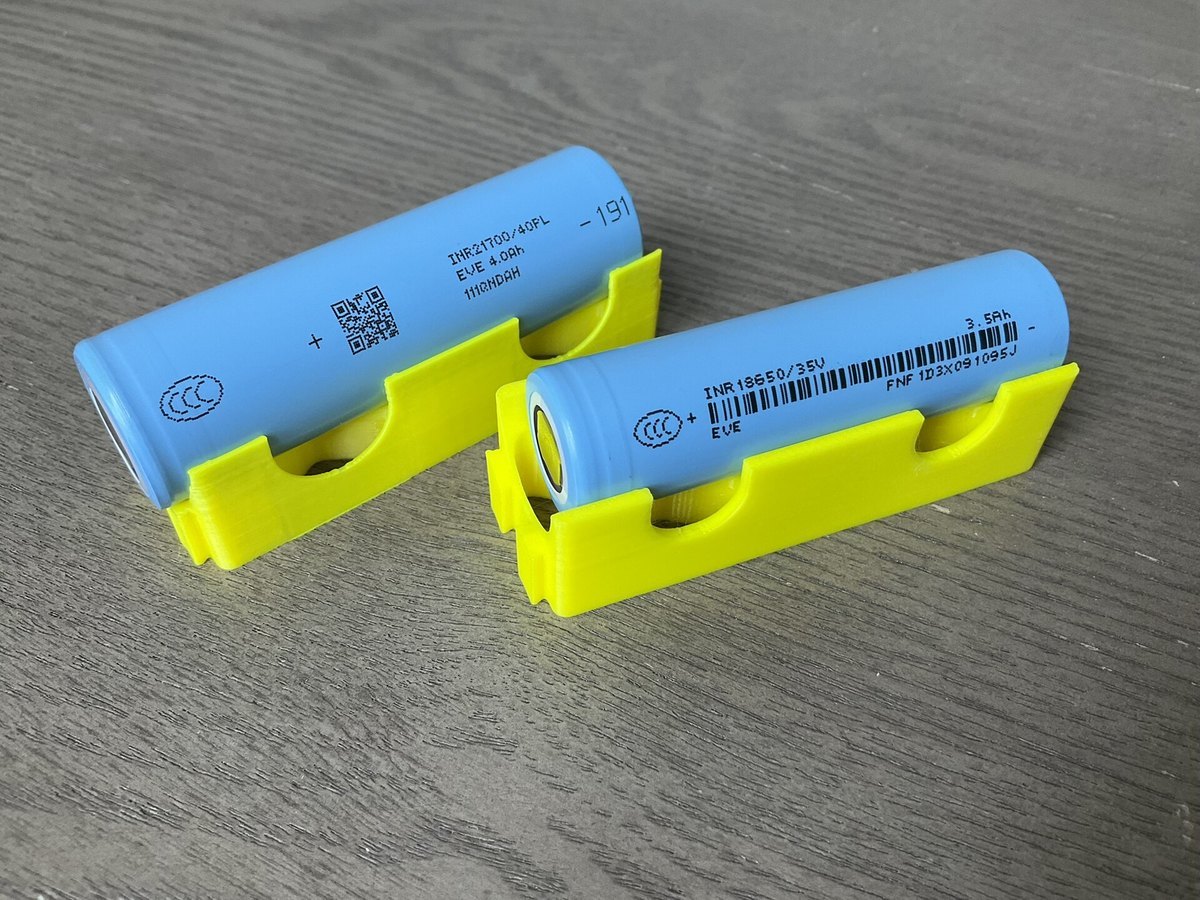 Production EVE INR21700-40PL and INR18650-35V cylindrical lithium-ion cells in positioning fixtures